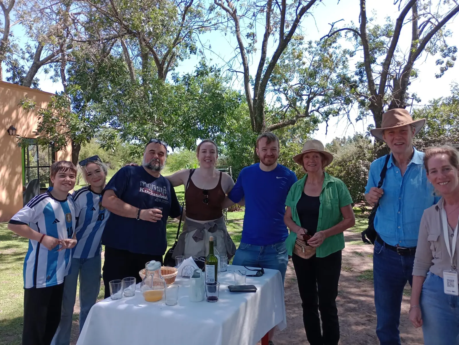 Débora with her group around the welcome table at the estancia