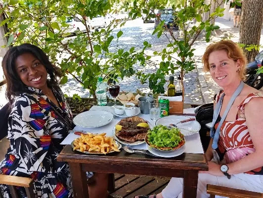 A shared table with Argentine food and wine